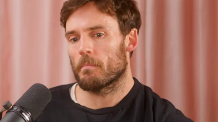 Sam Claflin discussing body dysmorphia and societal physical expectations in an interview