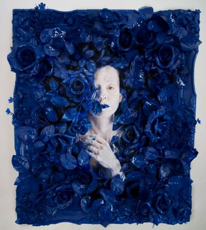 "Oil, spray paint, resin, and artificial roses on linen."