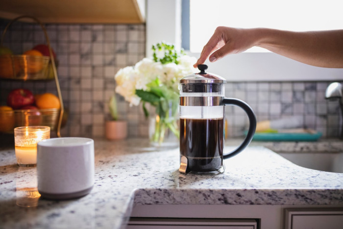 Researcher analyzing coffee consumption study data on cognitive health and dementia risk