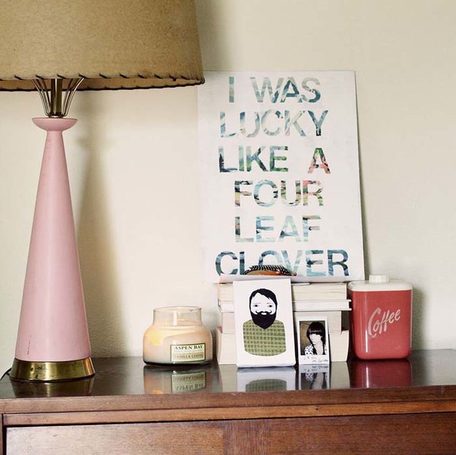 5. Revamp thrifted art with white paint and vinyl letters to personalize it.