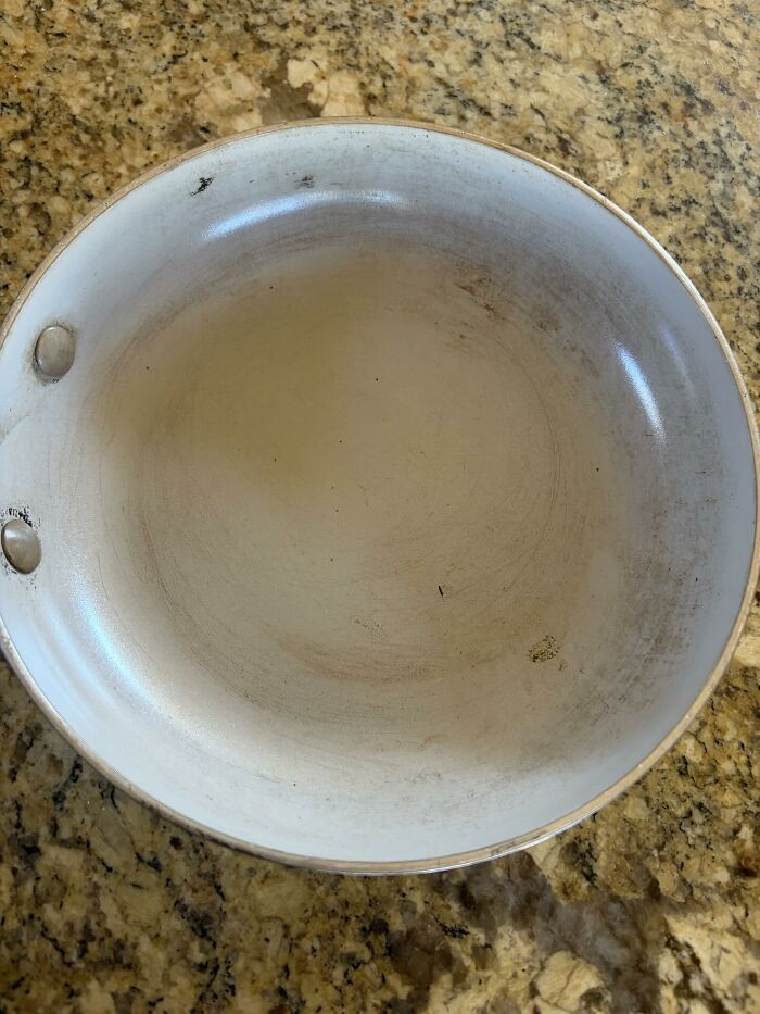 My Green Pan After I Returned From A Trip. After I Told Him So Many Times Not To Use High Heat Or Metal Utensils, And To Wait Until It Cools To Put It In The Sink