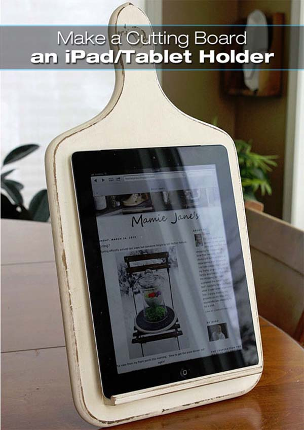 This involves some DIY, but a chopping board can be turned into a tablet holder.