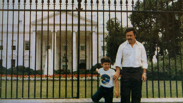 17. In the early 1980s, drug lord Pablo Escobar and his son are seen standing in front of The White House.