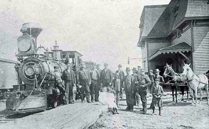"Men And Children Gather On The Platform Beside Prince Edward Island Railway Locomotive No. 5 At The Train Station In Souris, Prince Edward Island, In 1895"