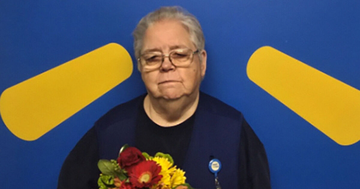 Why a photo of Gayle holding flowers after 44 years at Walmart exploded online