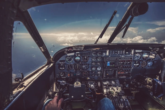 Close-up of cockpit window being cleaned with club soda for clarity.