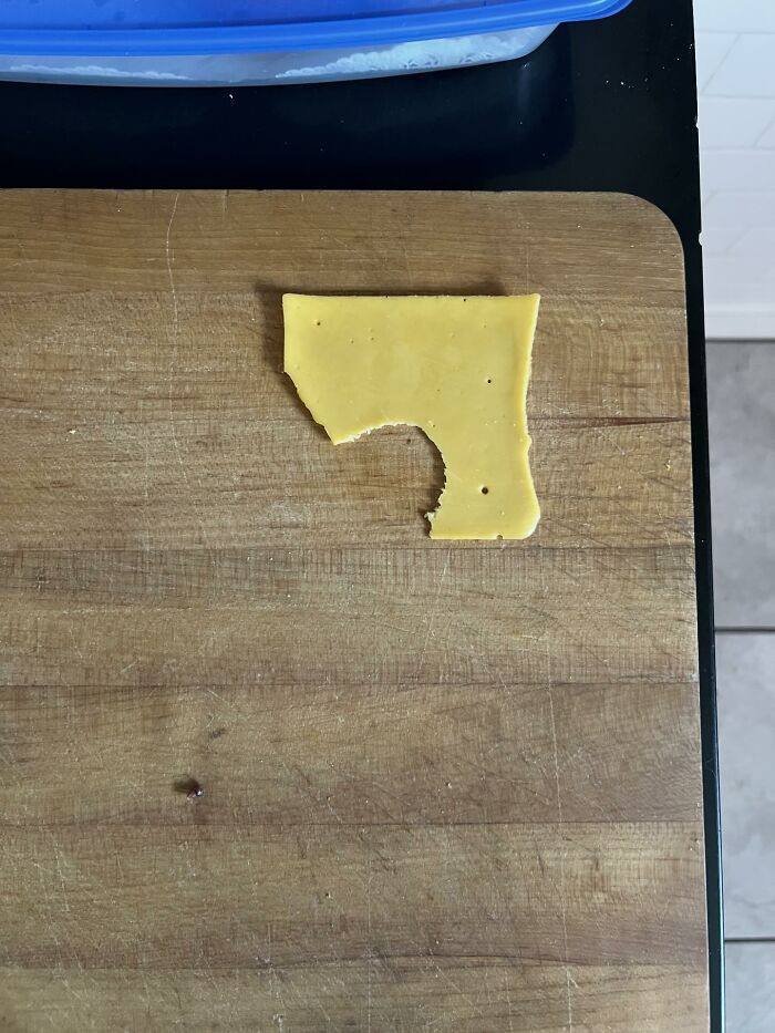 Still life of granola bar wrapper on surface, shared home with teenagers