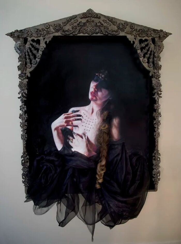 "Oil on linen with applied synthetic hair and fabric."