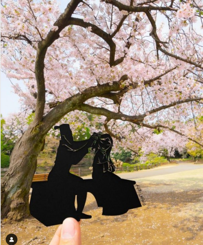 15. Mulan and Fa Zhou underneath a flowering tree in Shanghai Disney