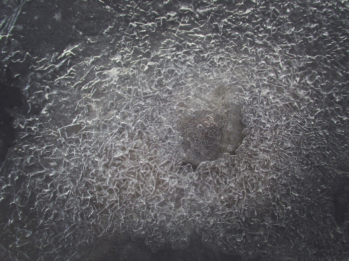 24. Cracked ice on the river: