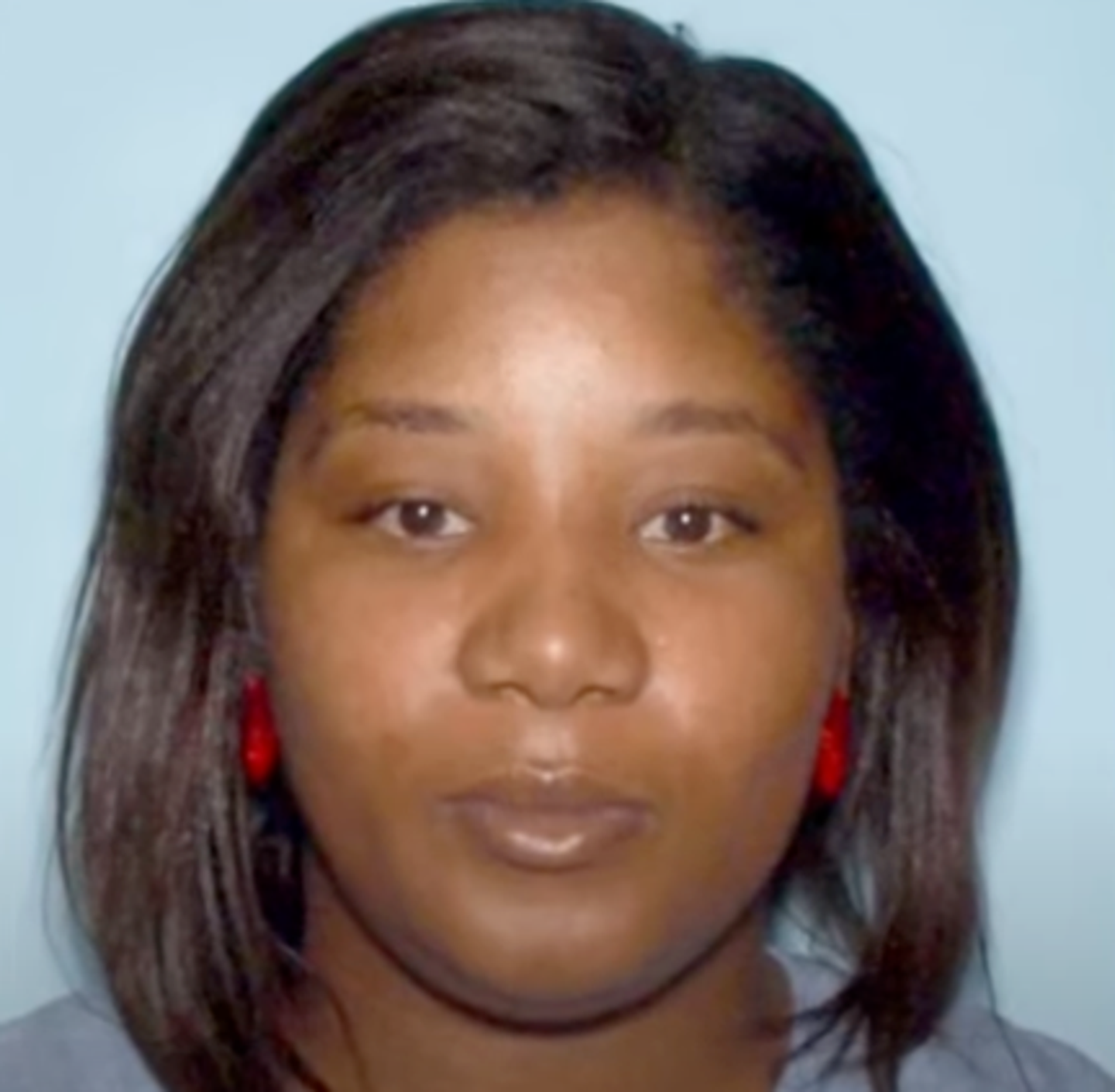 She is also accused of stealing her alleged victim's identity for eight years