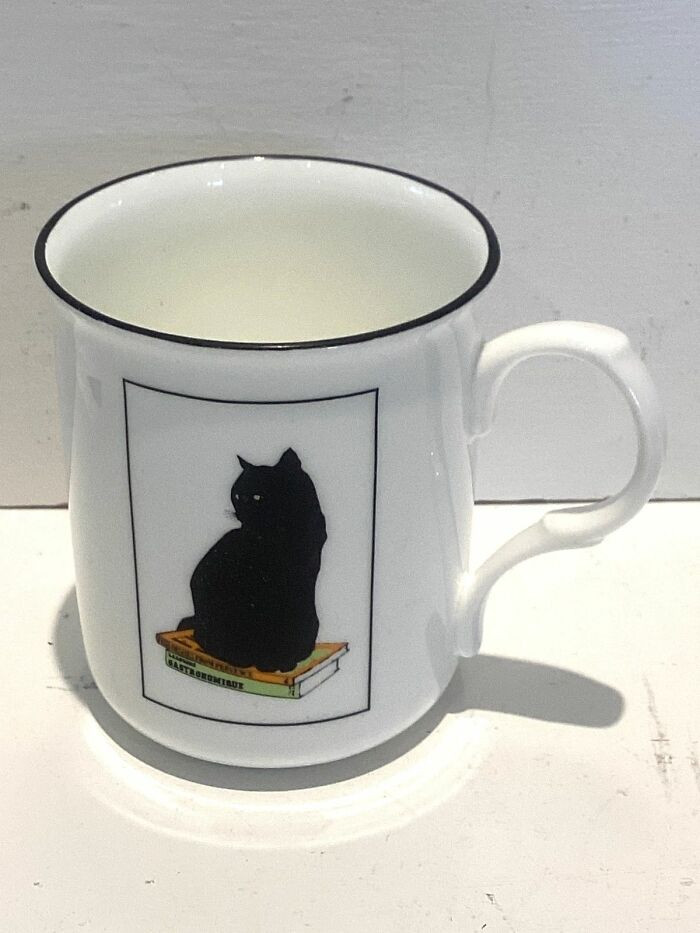 2. Sue Boettcher’s black cat mug: spooky, smart, and sophisticated