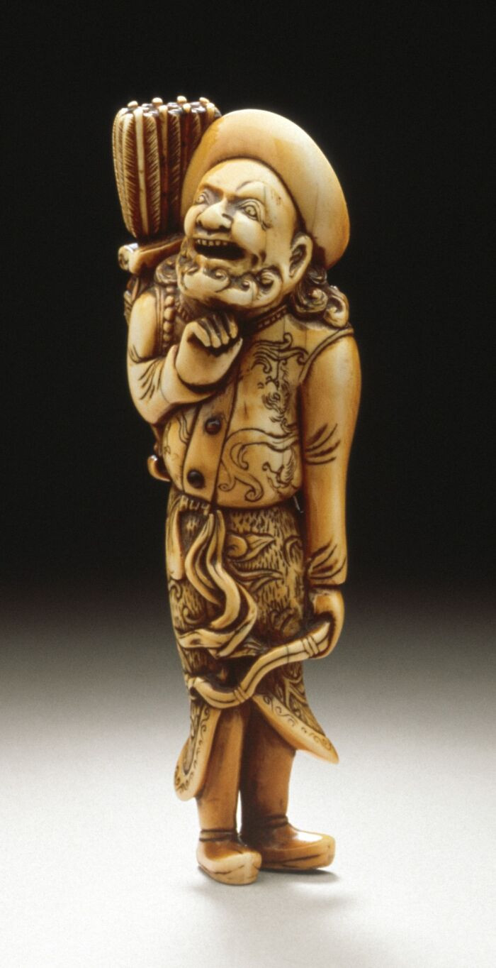 A finely carved ivory figure depicting a European archer, crafted by a Japanese artist between the 18th and early 19th century.