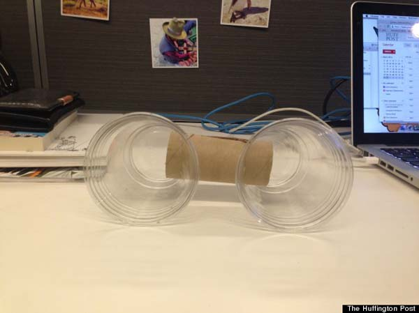 Get two cups and a toilet paper tube.