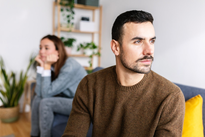 Man holding drink glass, discussing Dry January benefits for sexual health