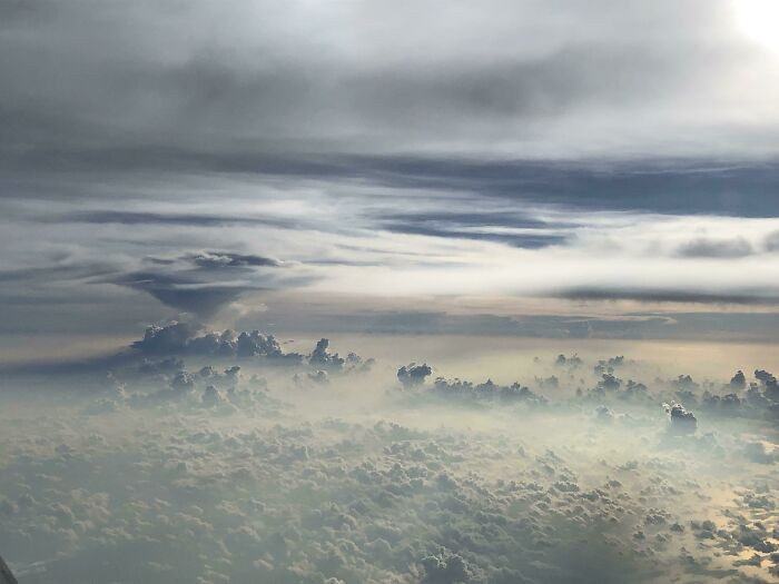 "The Clouds Outside My Plane Window Look Like An Alien Landscape"