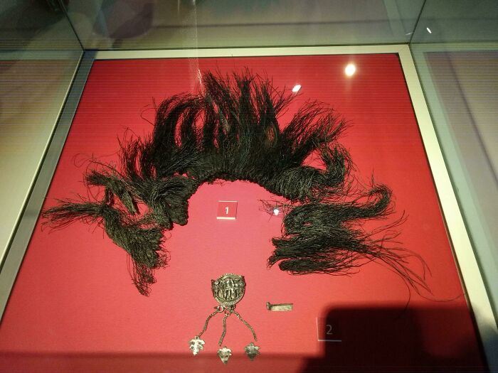 17. A unique remnant of a crest found on a Roman centurion's helmet, the sole surviving specimen of its kind.