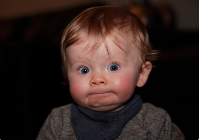 Stopping a kid from making silly faces.