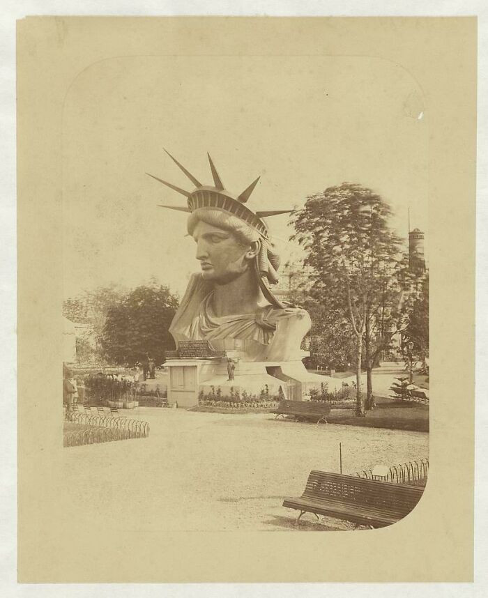 "The Statue Of Liberty's Completed Head Towering Over Visitors At The 1878 Paris Universal Exposition"