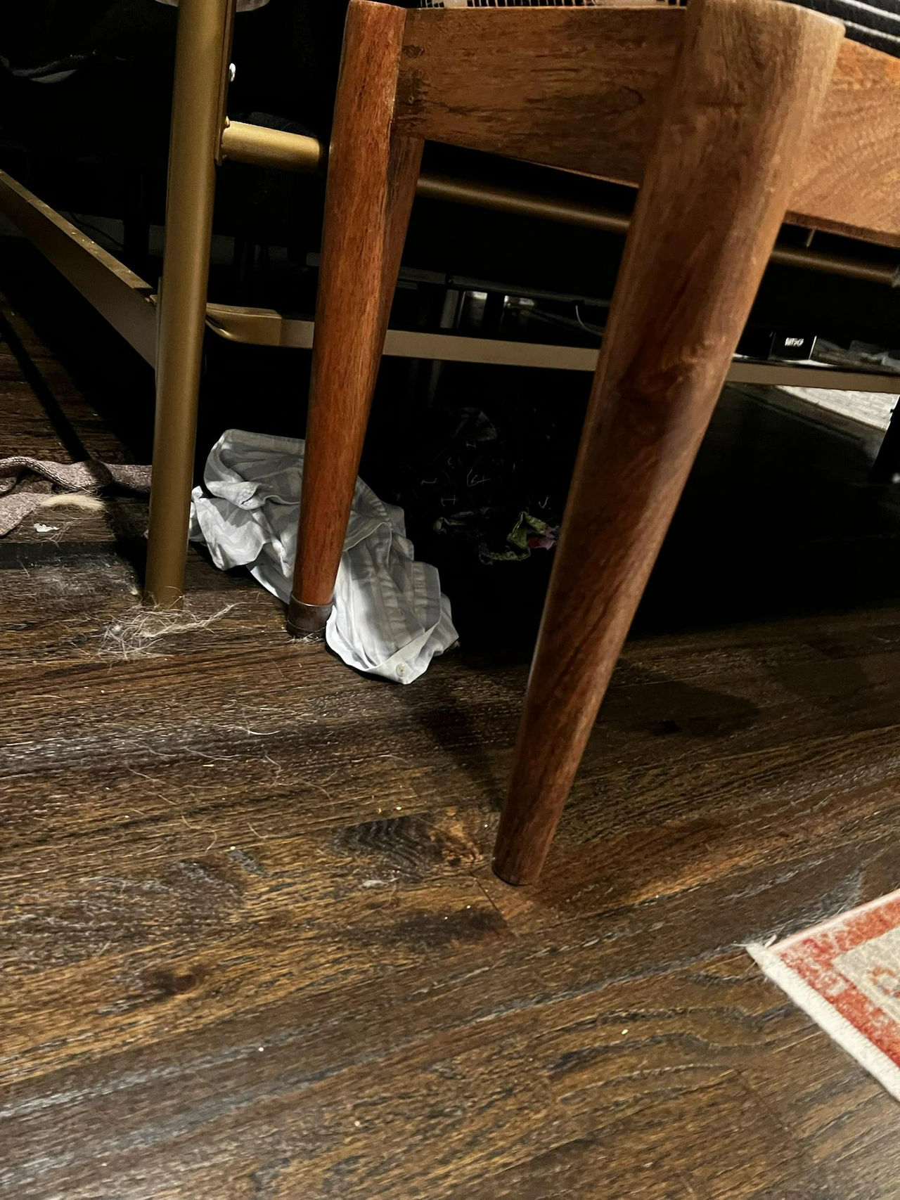 Her clothes under her bed that she left out: