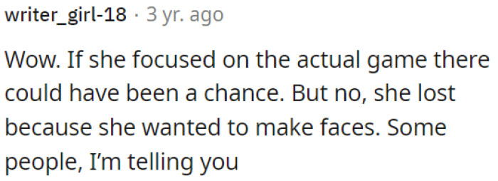 She lost the game because she was more focused on making faces instead of actually playing.