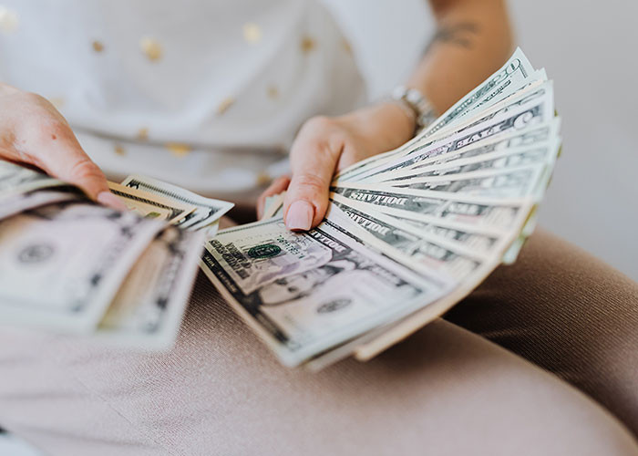 The OP chose to keep the money, and in one of the updates to her story, she stated that she and her mother would establish a scholarship for people interested in her field of study who are in greater need of the money given to her