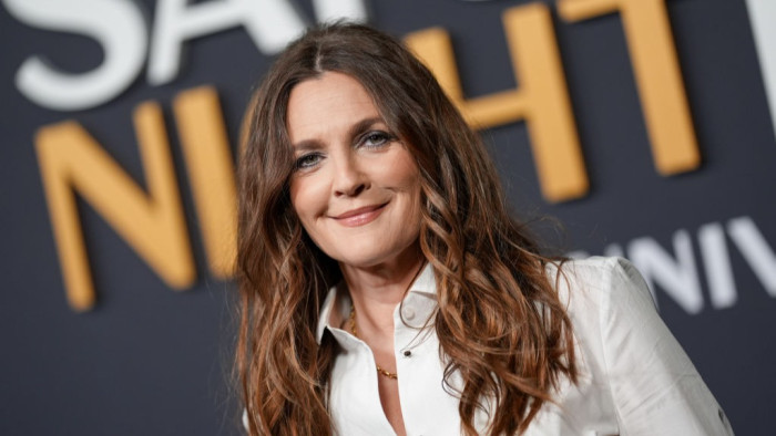 Drew Barrymore discussing the mile high club with humorous, surprised expression