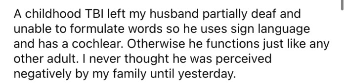 OP's husband is deaf due to a childhood TBI, so he uses sign language to communicate.