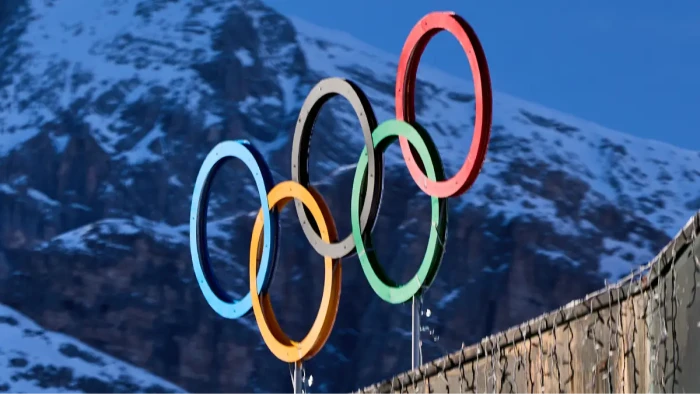 Stacked condom supply containers near Olympics venue, demand exceeds 300,000 count
