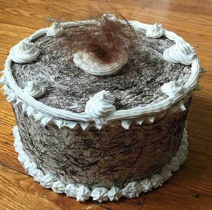 2. This cake decorated with real hair…