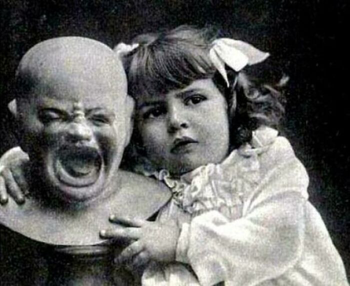 "A Young Girl With A Strange Doll"