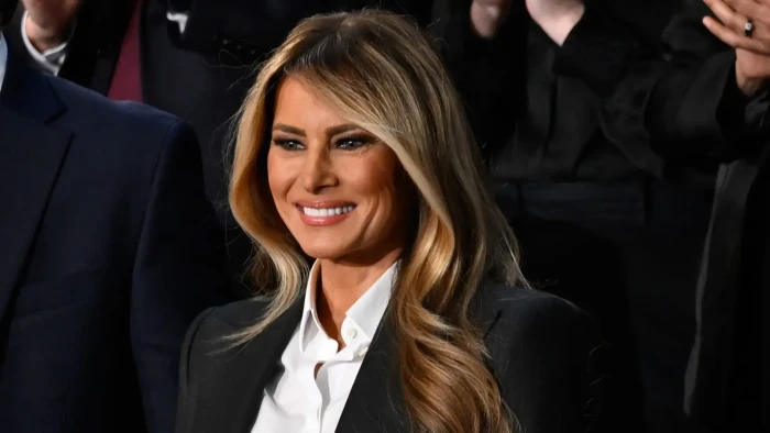 Donald Trump reacting with humor while referencing Melania Trump’s bipartisan success