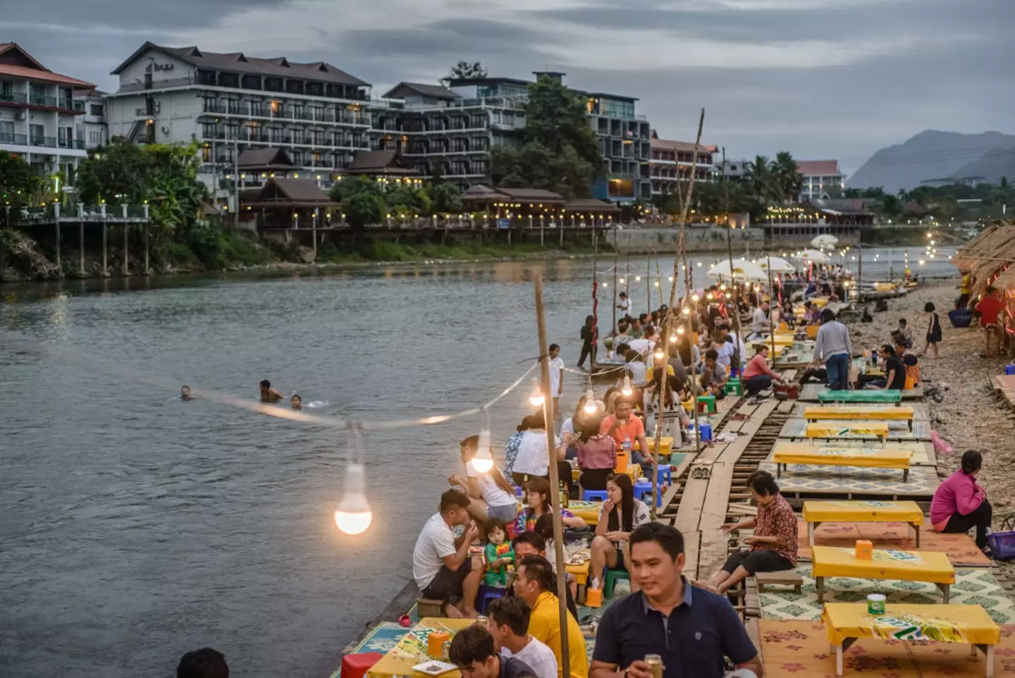 Vang Vieng's iconic riverside scene, once a backpacker’s dream, now raises troubling questions about safety