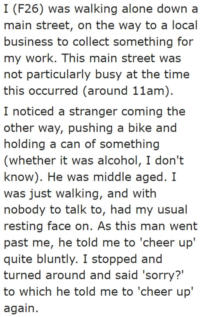 The stranger told her to cheer up when they walked past each other.