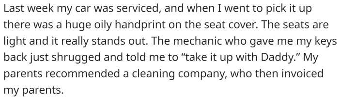 OP was disappointed to find a huge oily handprint on the seat cover of their car when they went to pick it up.