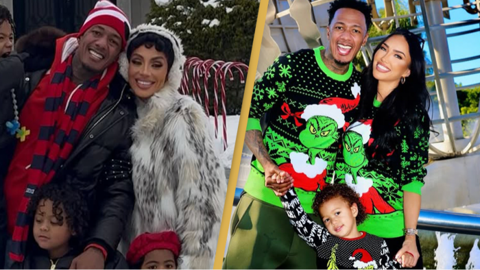 Nick Cannon posing in a festive Christmas photoshoot with his children