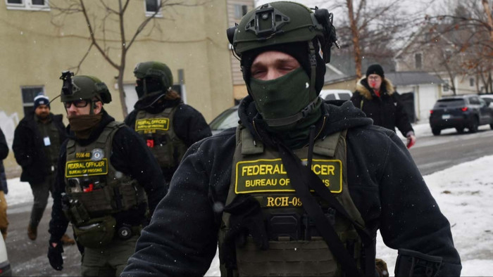 ICE officers arresting restaurant employees after a meal earlier that day.
