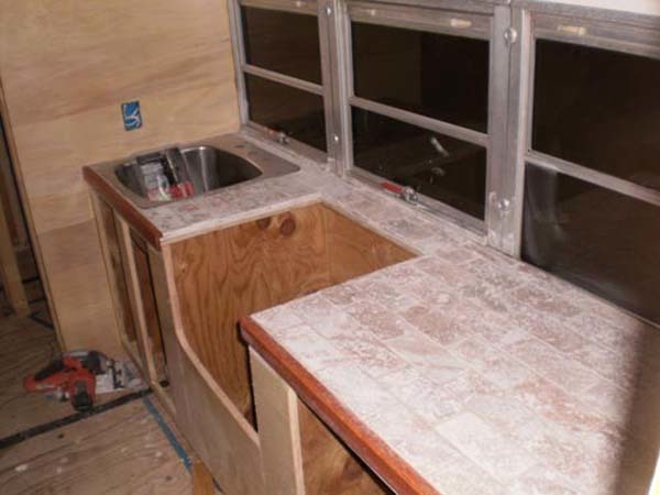 Stone tile was chosen for the countertops.