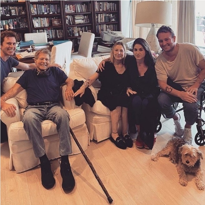 They have three children: Emily, Sean, and Kevin. They are with their grandpa, Ryan O'Neal, in the picture below