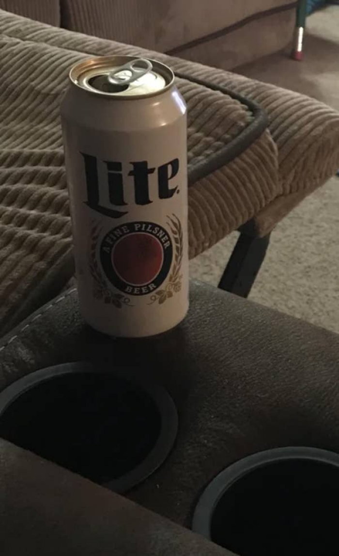 5. This man doesn't understand the purpose of cupholders: