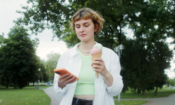 "Was holding my phone and ice cream in a cone. Phone rang, answered ice cream. A sticky ear is surprisingly uncomfortable."
