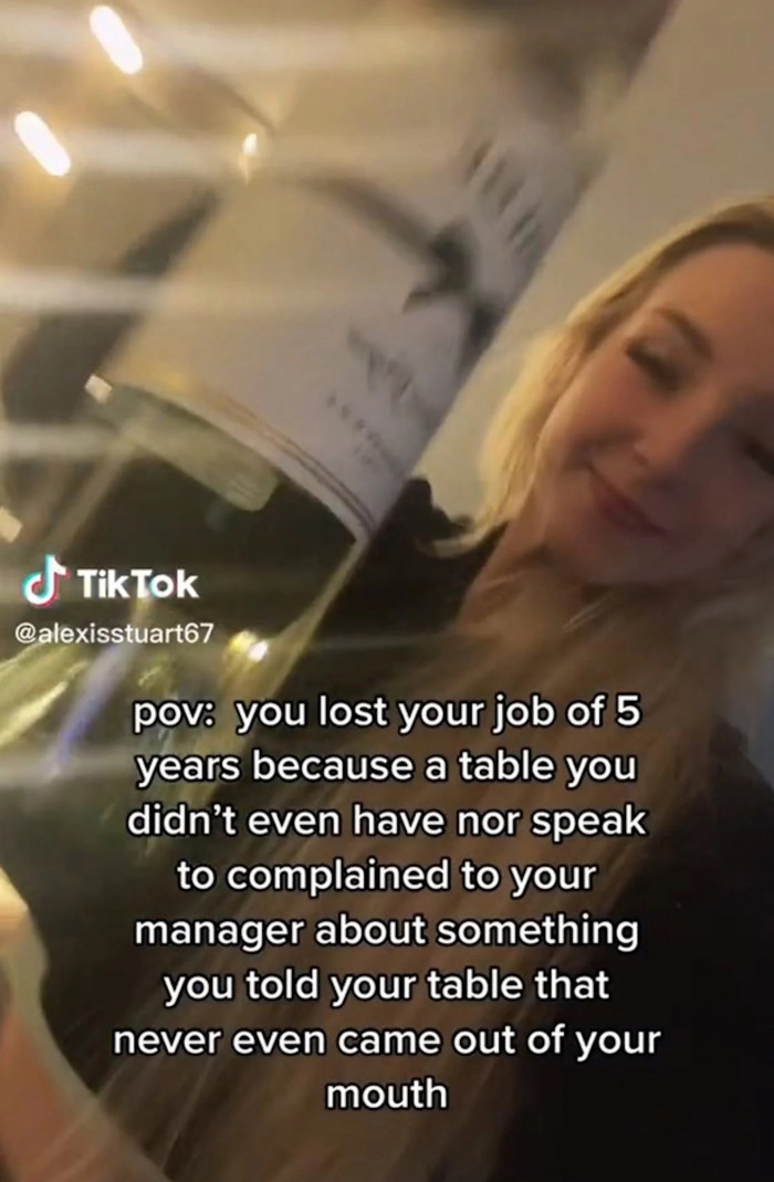 In the video, Alexis Stuart can be seen dancing in a house while holding a bottle of white wine.