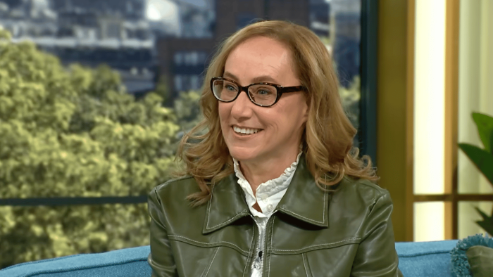 Mother and family members reacting with humor to a sex surrogate interview