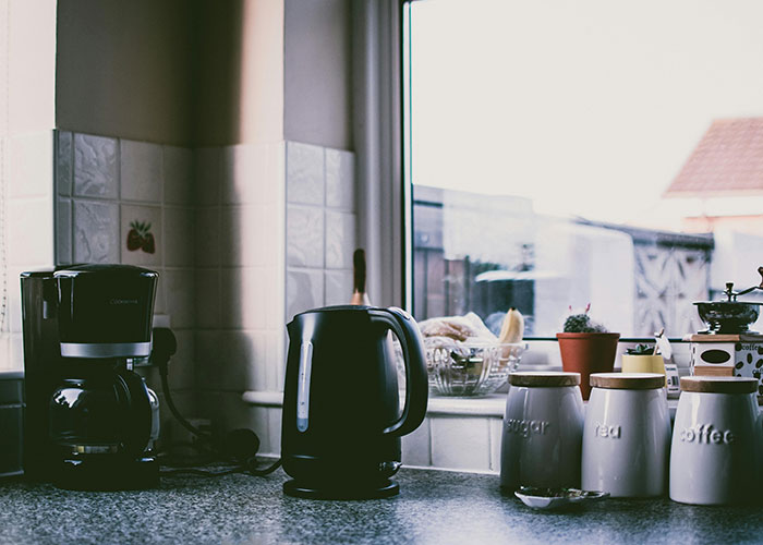 Polish or wipe down the kitchen bin, kettles, and other shiny things on the counters