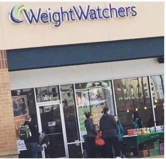 18. Check out these Girl Scouts selling cookies outside a Weight Watchers