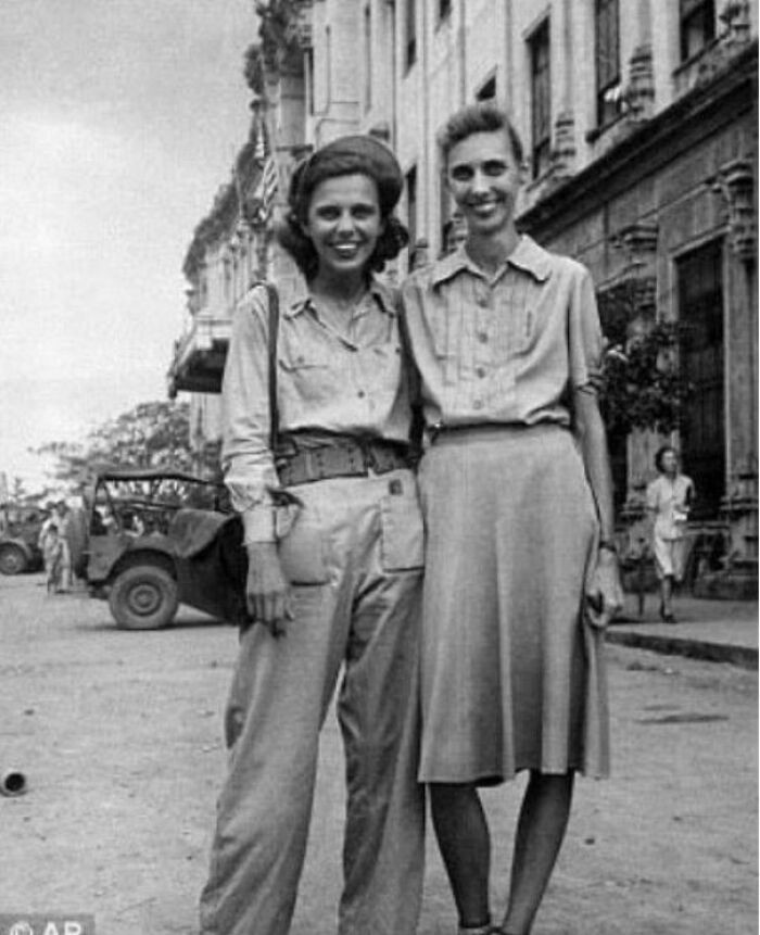 "Nurse Dorothy Davis, a Member of the Famed Angels of Bataan, Smiles with Her Sister After Being Freed from Years of Suffering as a Prisoner of War at Santo Tomas in the Philippines. Feb 1945."