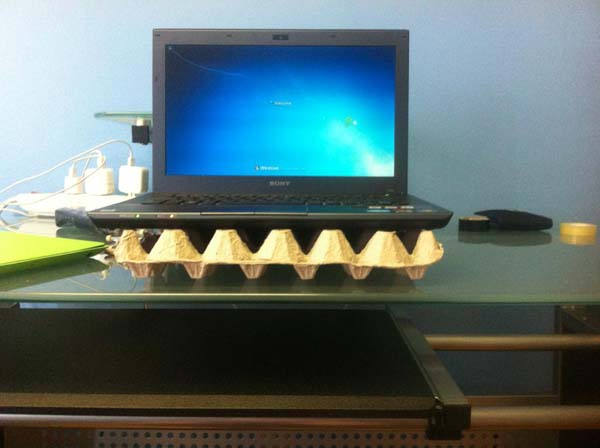 An egg carton can be used as a stand for overheating laptops.