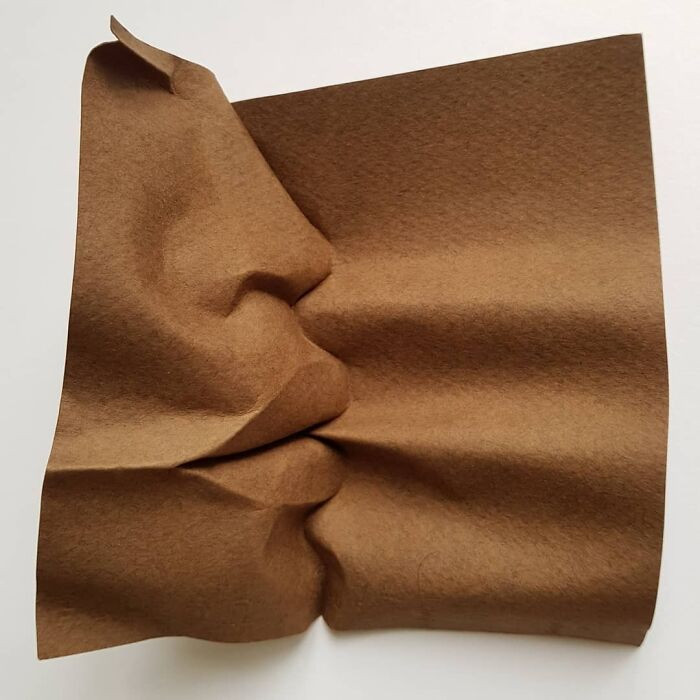 Paper artwork with smoky, environmental vibe, rhomboid pixelation texture around the portrait.