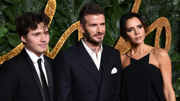 Brooklyn Beckham in news coverage, discussing savage response to parents David Victoria
