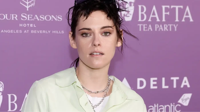 Kristen Stewart speaking to reporters, backlash over comments about burgers and immigrants.